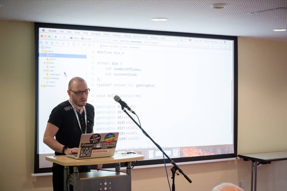 me, at macoun 2017 in front of some swift source code about gaming dice